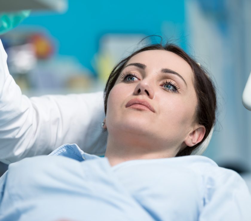 Dentist,Examining,Patient,Teeth,With,A,Mouth,Mirror.,Dentist,Is