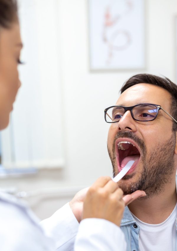 Male,Patient,Opening,His,Mouth,For,The,Doctor,To,Look