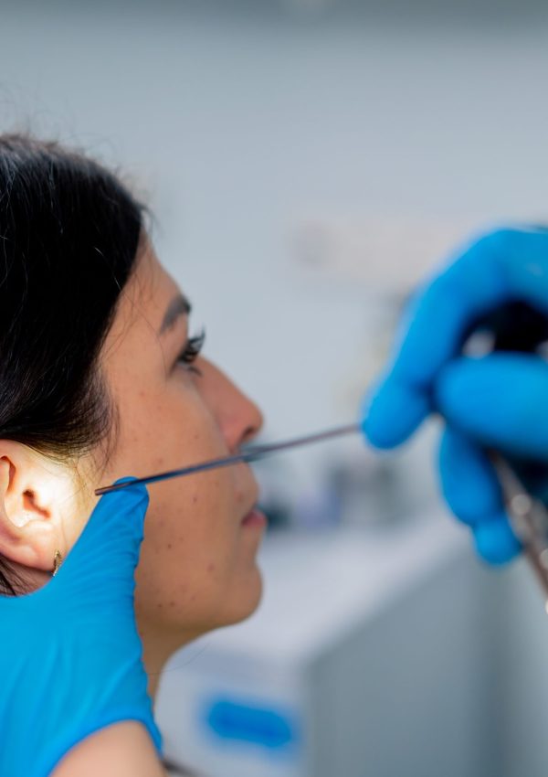 An,Ent,Doctor,Performs,An,Endoscopy,Procedure,On,A,Patient's