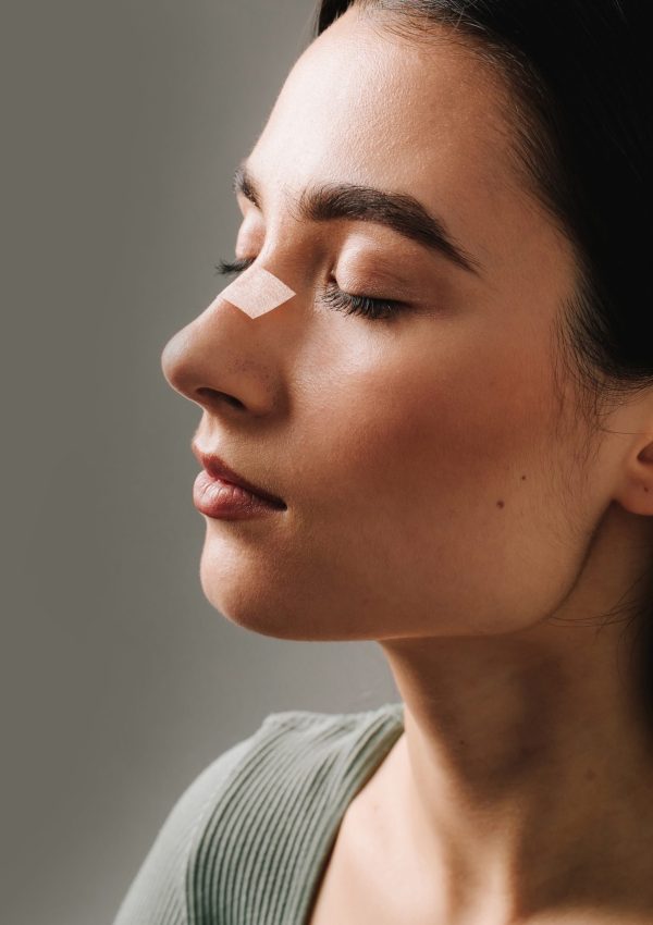 Rhinoplasty.,Applying,Bandage,On,Nose,After,Surgery,To,Support,Its