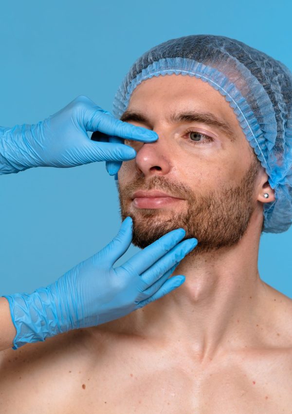 A,Medical,Professional,Examines,A,Male,Patient,Nose,During,A